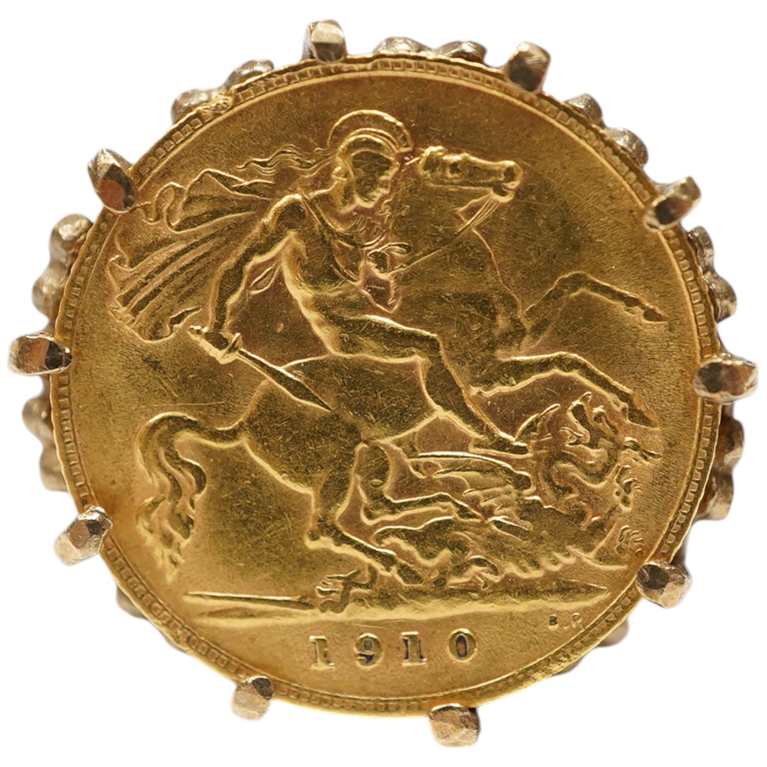 A George V gold half sovereign, in a later pierced and carved 9ct god ring mount, size P, gross weight 10 grams. Condition - fair.